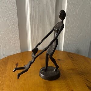 Cast Iron Mom and Child Swinging Sculpture